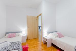 Posteľ alebo postele v izbe v ubytovaní Apartments Flor de Lis
