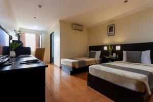 Ένα ή περισσότερα κρεβάτια σε δωμάτιο στο Technopark Hotel