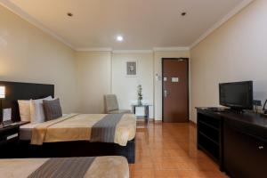 Ένα ή περισσότερα κρεβάτια σε δωμάτιο στο Technopark Hotel