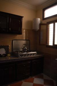 a kitchen with a stove top on a counter at Résidence dikre in Ouarzazate