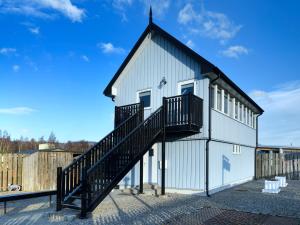a building with a staircase on the side of it at Signal Box in Newtonmore