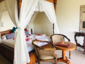 Postel nebo postele na pokoji v ubytování Patatran Village Hotel