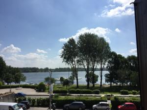 a view of the water from a parking lot at Residenza Bibiena in Mantova