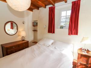 En eller flere senge i et værelse på Lane Fold Cottage