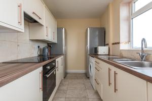 A kitchen or kitchenette at Cook Avenue