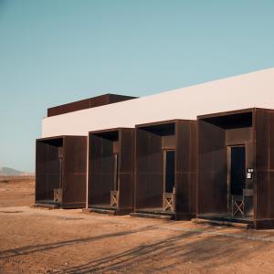 a building in the middle of the desert at Mysk Al Faya Retreat in Sharjah