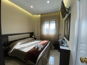 Postel nebo postele na pokoji v ubytování Grand Hotel Royal