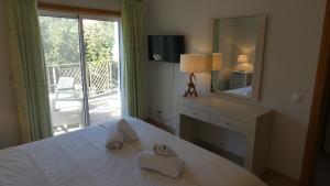 Ένα ή περισσότερα κρεβάτια σε δωμάτιο στο LakeView Boavista +19 φωτογραφίες