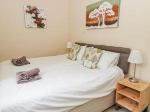 Postel nebo postele na pokoji v ubytování Fern House