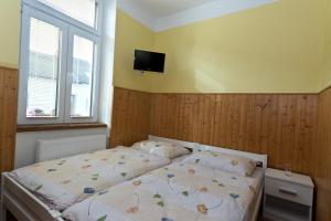 Posteľ alebo postele v izbe v ubytovaní Romance Ubytování