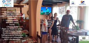 a flyer for a restaurant with a family posing for a picture at Hotel El Nevado, Malargüe Mendoza in Malargüe +78 photos