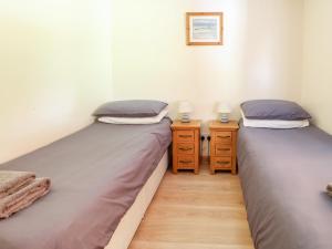 A bed or beds in a room at Dragonfly Lodge