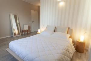 A bed or beds in a room at Corte castella
