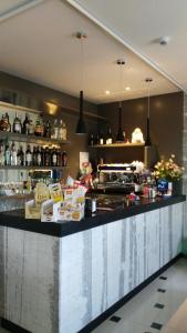 a bar in a restaurant with a counter at Albergo Suisse Bellevue in Monterosso al Mare
