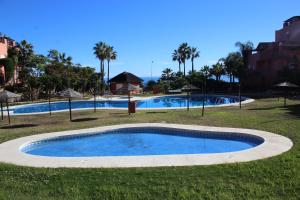 Bazén v ubytování Bonito y tranquilo apartamento , cerca del mar. nebo v jeho okolí