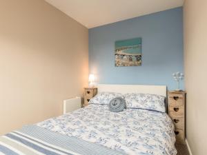 En eller flere senge i et værelse på Rock Rose