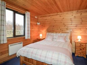 Ένα ή περισσότερα κρεβάτια σε δωμάτιο στο Wildcat Lodge