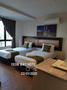 Postel nebo postele na pokoji v ubytování Yeob Bay hotel Ampang
