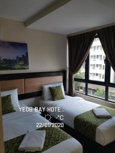 Postel nebo postele na pokoji v ubytování Yeob Bay hotel Ampang