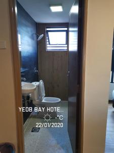 a bathroom with a toilet and a sink at Yeob Bay hotel Ampang in Ampang