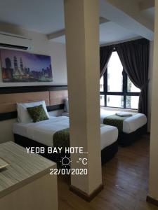 Postel nebo postele na pokoji v ubytování Yeob Bay hotel Ampang