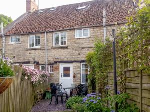 an old stone house with a white door at 31 Outgang Road in Pickering