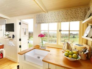 a kitchen with a sink and a window at Willow in Wadebridge