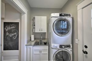 a kitchen with a washing machine and a sink at Renovated Craftsman House with Patio and Fire Pit! in Vevay
