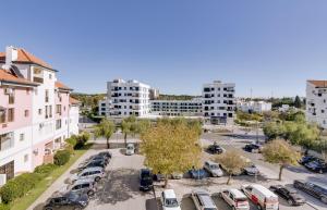 an aerial view of a parking lot in a city at Cruzeiro do Sul Apartments - Vilamoura center in Vilamoura