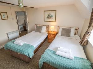 Ένα ή περισσότερα κρεβάτια σε δωμάτιο στο Hill Farm Cottage