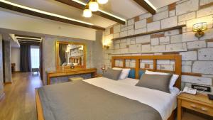 Ein Bett oder Betten in einem Zimmer der Unterkunft Yılsam Sultanahmet Hotel