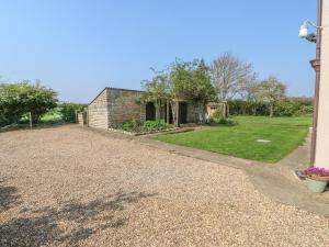 גינה חיצונית ב-Grange Farm Cottage