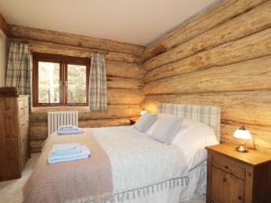 Llit o llits en una habitació de Heron Lodge