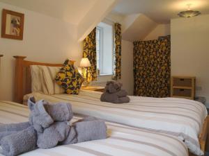Ένα ή περισσότερα κρεβάτια σε δωμάτιο στο Heyden Cottage