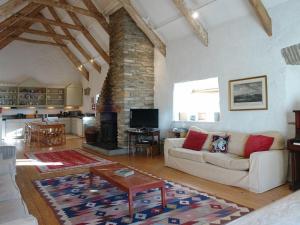 a living room with a couch and a table at Harry in Bodmin