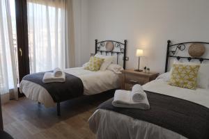 A bed or beds in a room at MIRADOR DE LAS VILLUERCAS
