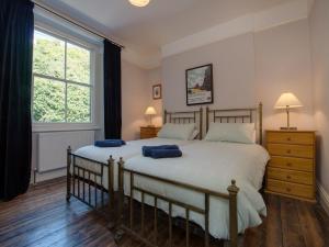 Ένα ή περισσότερα κρεβάτια σε δωμάτιο στο The Captains House