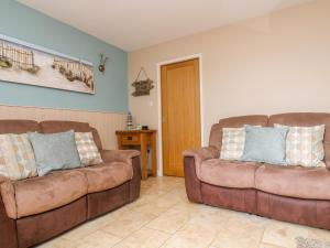 A seating area at 3 Trungle Cottages