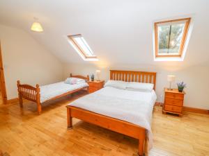 Llit o llits en una habitació de Mary Agnes Cottage