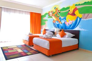 a bedroom with two beds with a disney mural at Parrotel Lagoon Waterpark Resort in Sharm El Sheikh +37 photos
