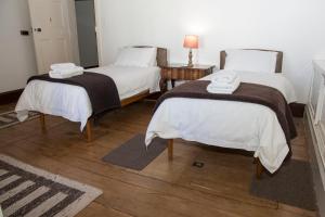 Postel nebo postele na pokoji v ubytování Roode Bloem Farm House