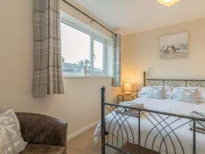 En eller flere senge i et værelse på Crumstone Corner