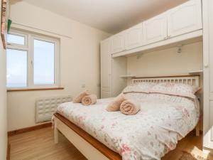 Un pat sau paturi într-o cameră la Kitticarn