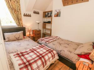 מיטה או מיטות בחדר ב-Crinan Canal Cottage No8