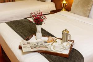 Letto o letti in una camera di Hamlet Court Hotel