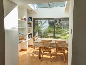 a dining room with a table and chairs and a window at 6 Knott in Flashader