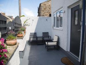 En balkon eller terrasse på Seashell Cottage