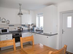 Køkken eller tekøkken på Seashell Cottage