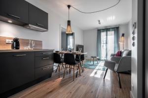 a kitchen and dining room with a table and chairs at La Grange des Pères in Pringy