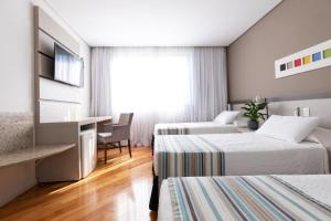 Cama ou camas em um quarto em Viale Cataratas Hotel & Eventos